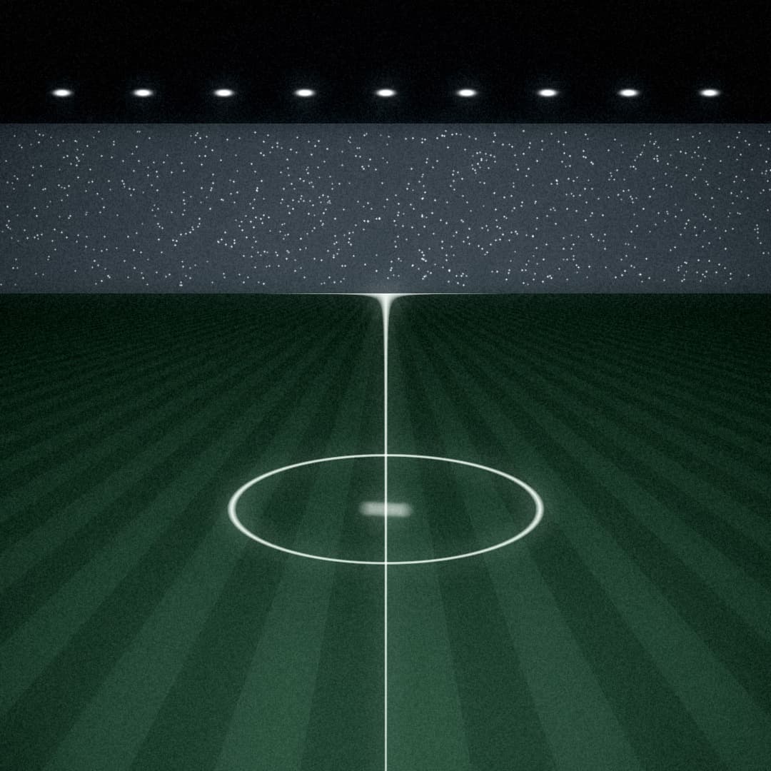 Campo de fútbol de noche, círculo central bajo los focos